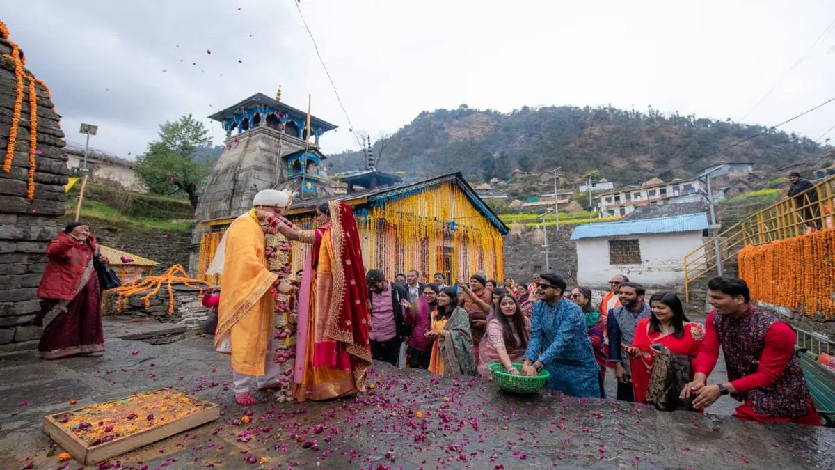 Bride and groom taking pheras during a destination wedding at Triyuginarayan temple